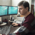 Aris Danikas shows Kathimerini the videos he took in South Africa. (Photo by Enri Canaj)