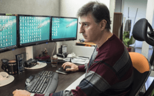 Aris Danikas shows Kathimerini the videos he took in South Africa. (Photo by Enri Canaj)