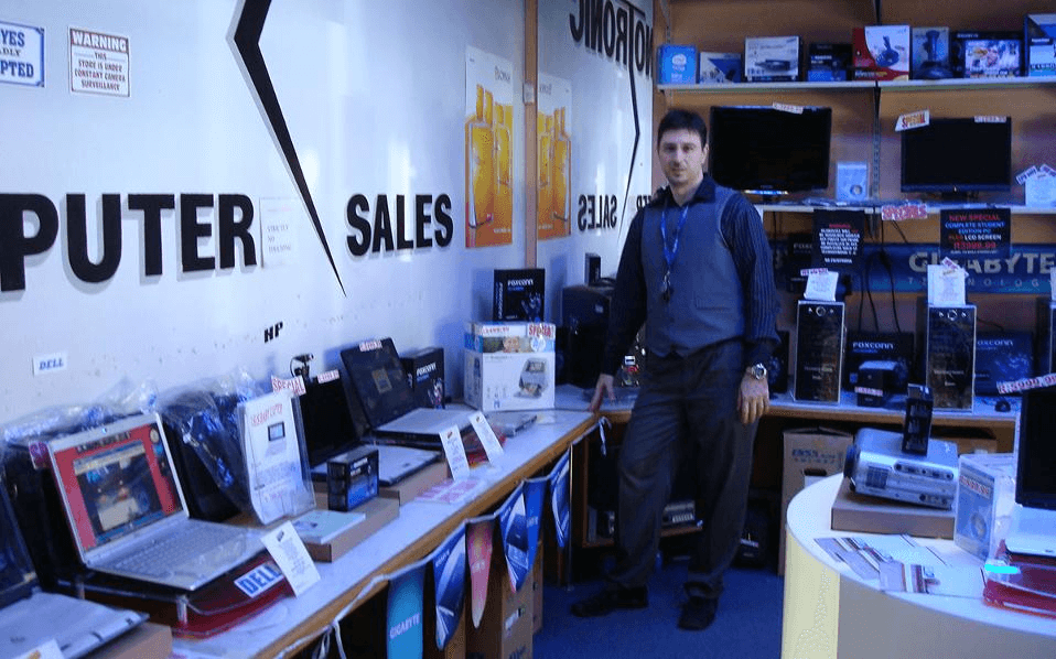 "Press him in the stomach to die faster" 1 Aris Danikas at his store in South Africa.